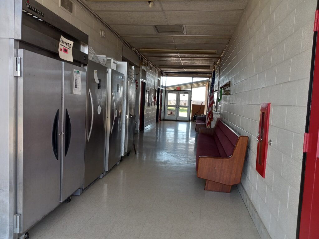 hallway with freezers